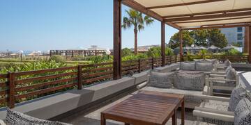 a patio with a table and chairs
