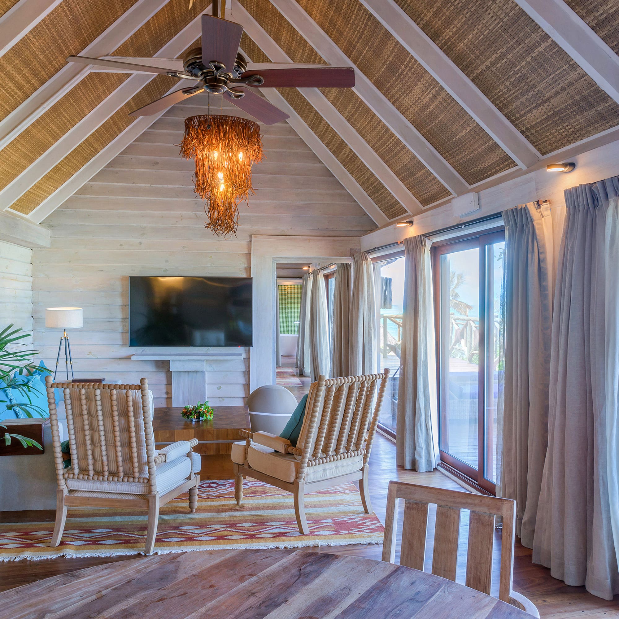 a room with a television and chairs