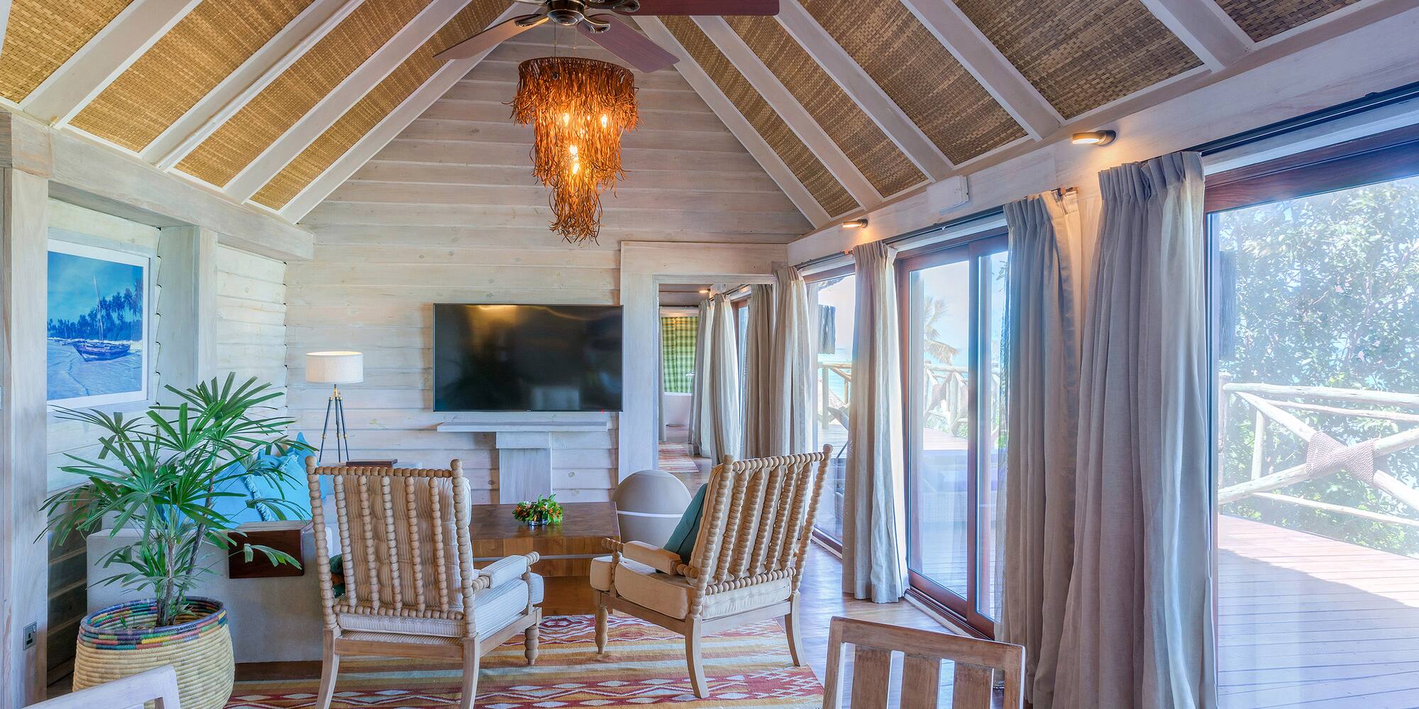 a room with a television and chairs