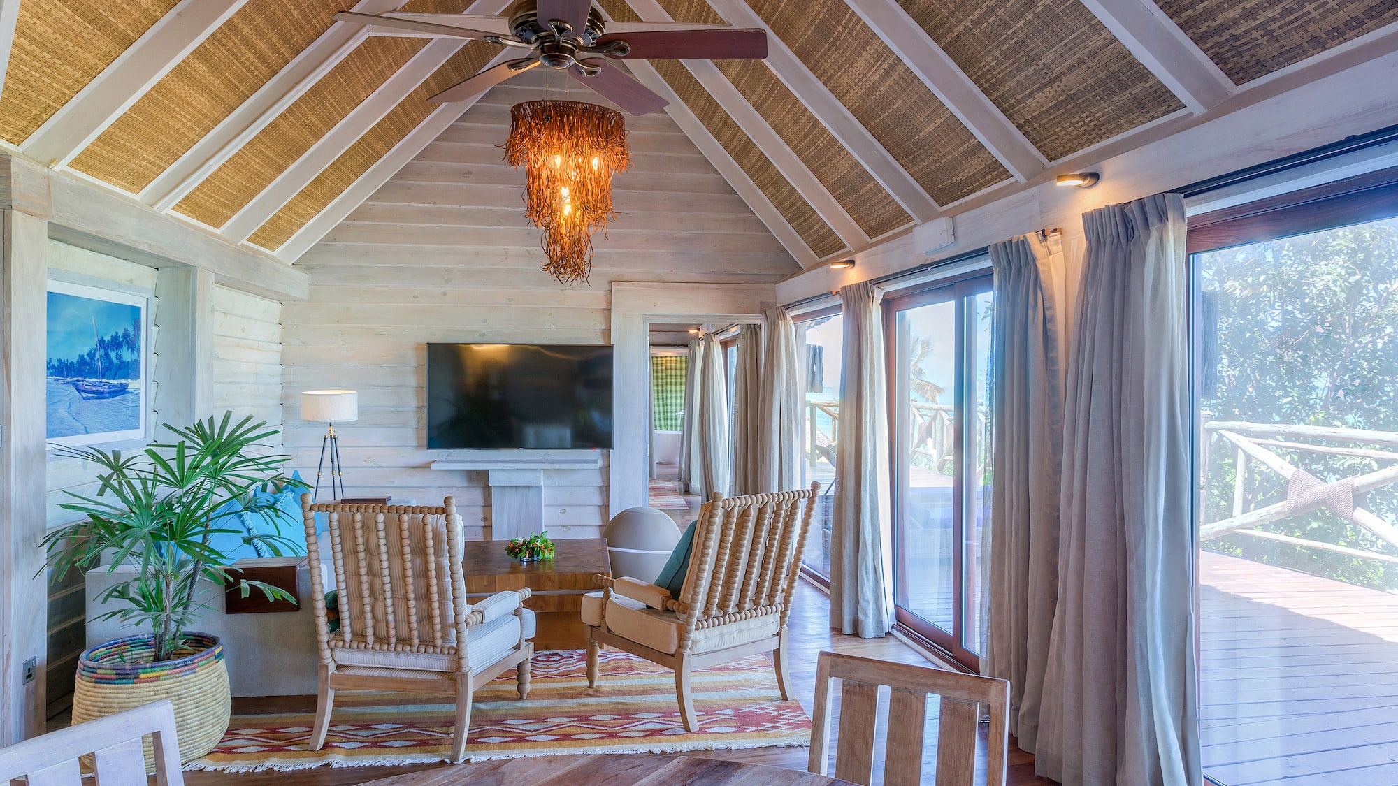 a room with a television and chairs