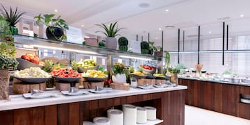 a buffet with fruits on shelves