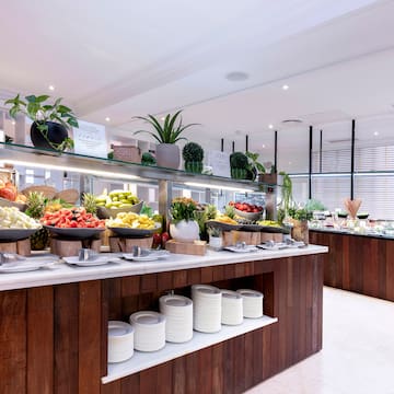 a buffet with fruits on shelves