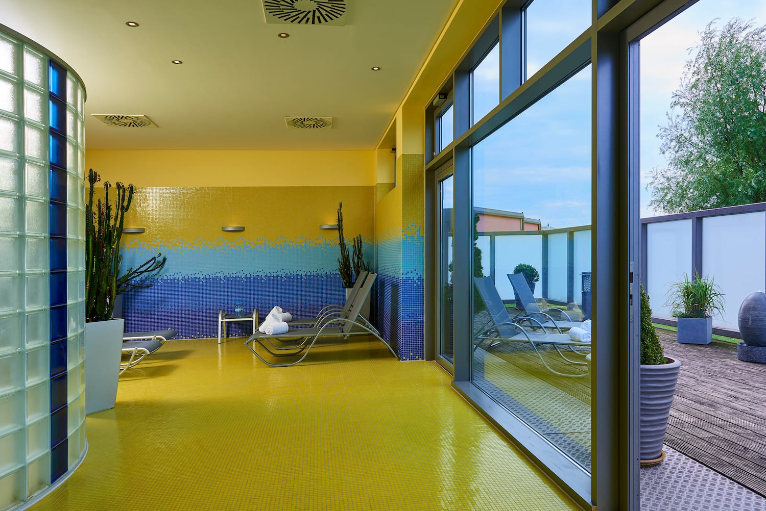 a room with chairs and a large glass door