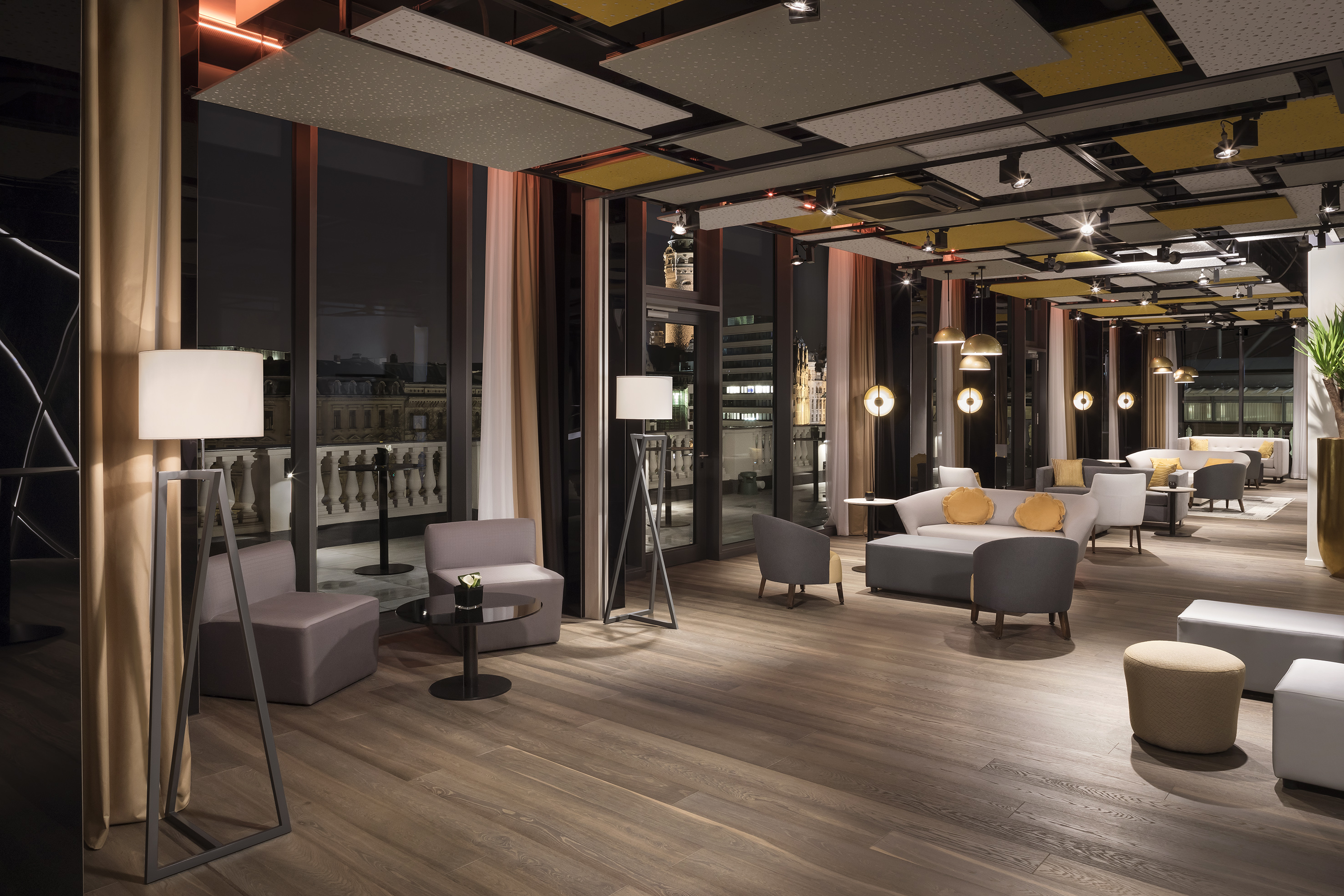 a room with a large window and a couch