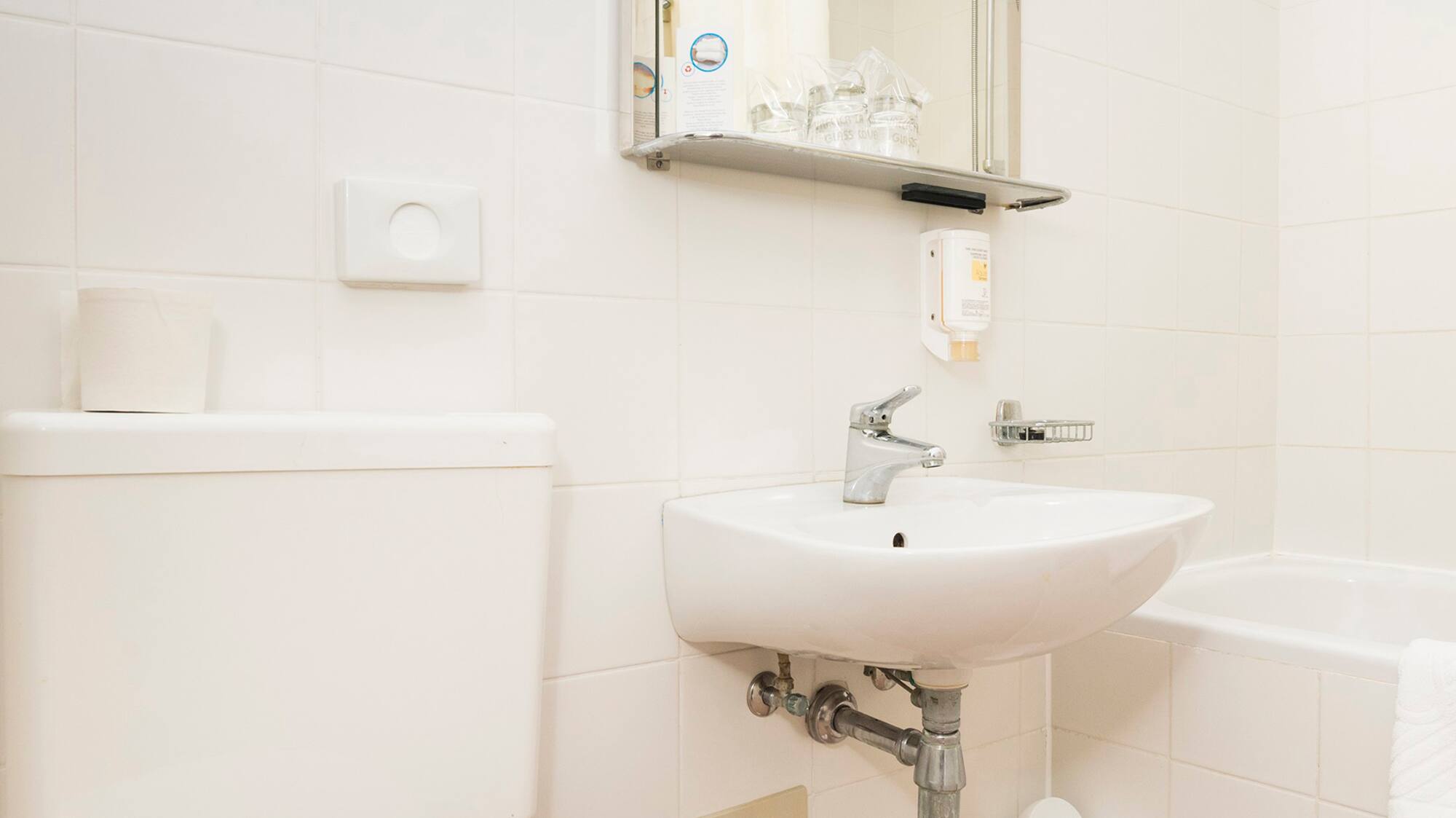 a bathroom with a sink and toilet