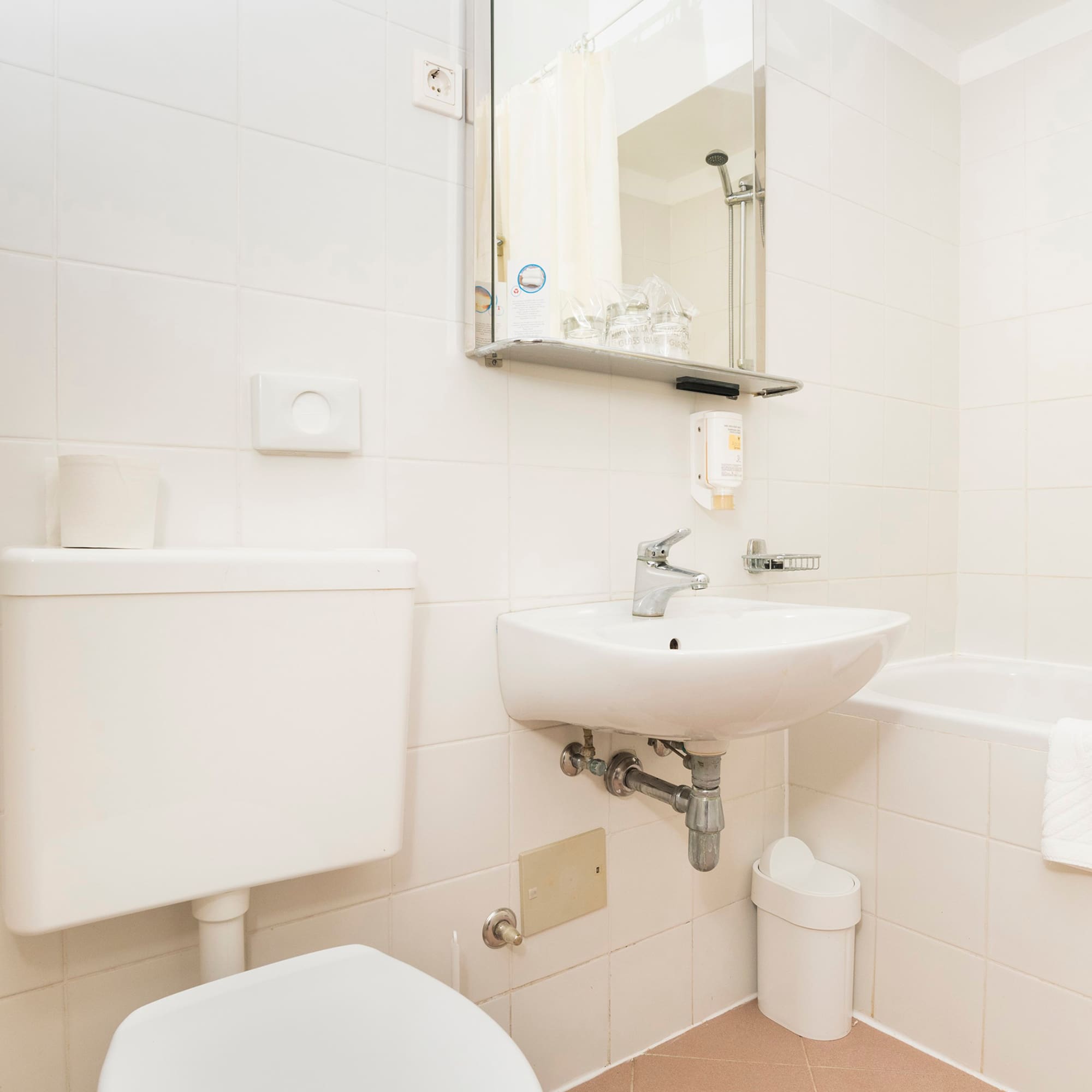 a bathroom with a sink and toilet