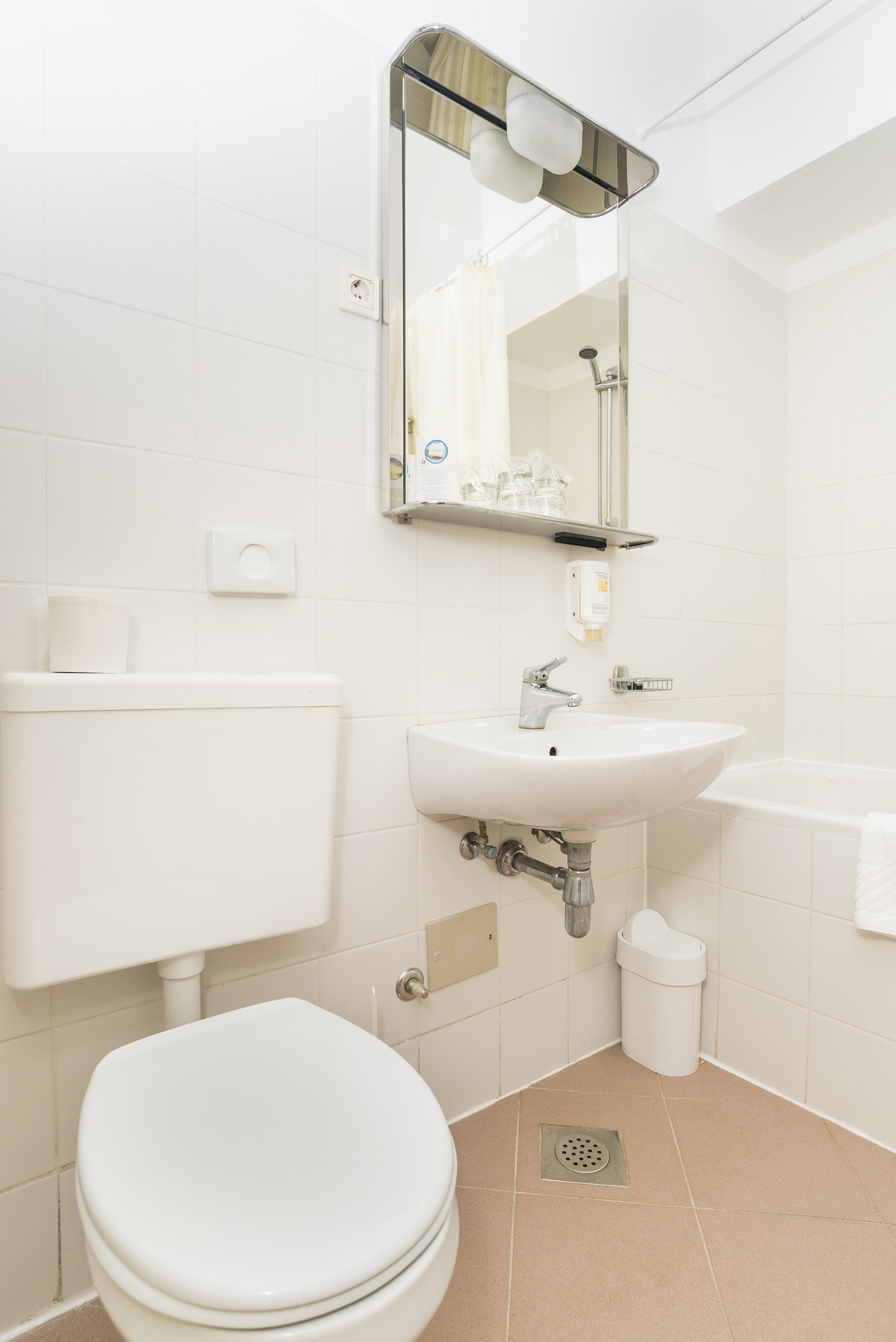 a bathroom with a sink and toilet