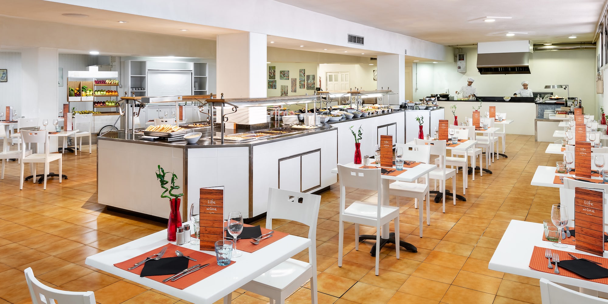 a restaurant with white tables and chairs