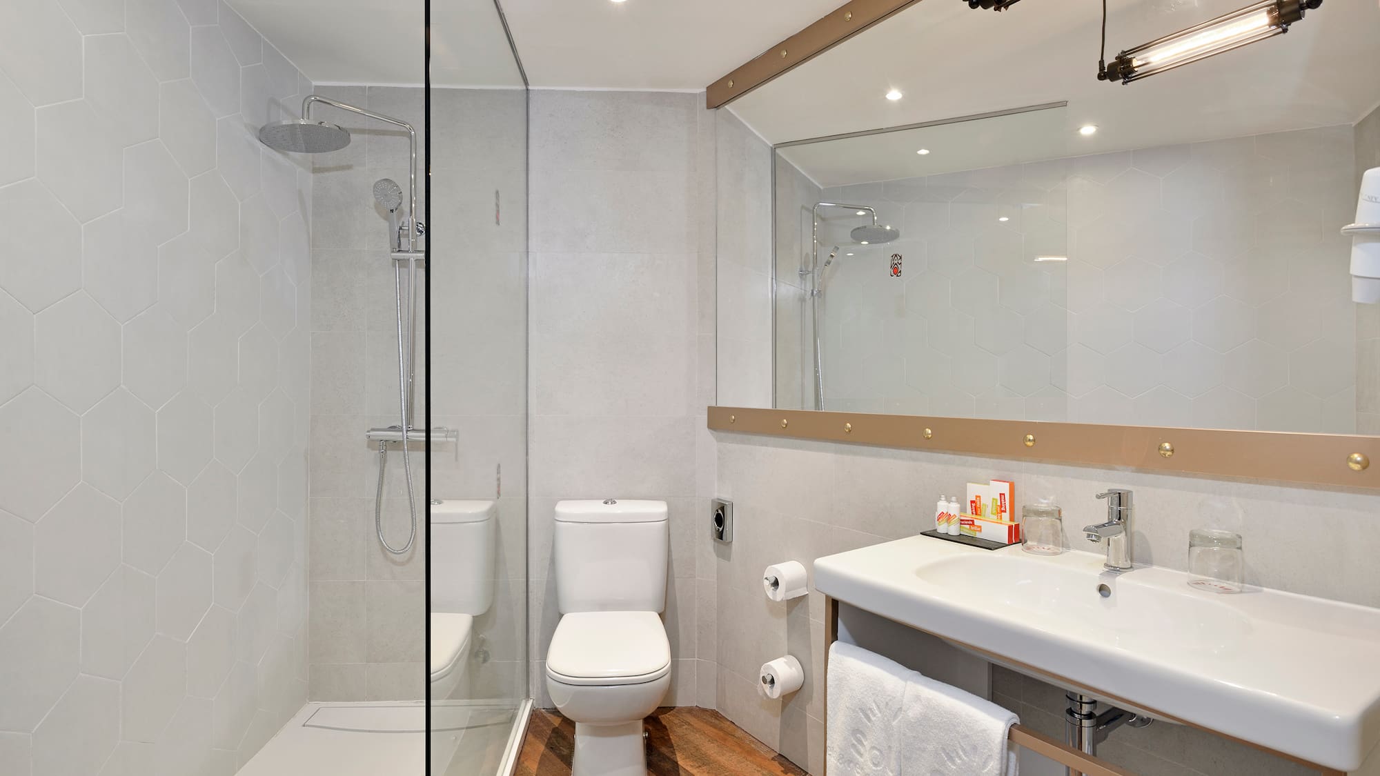 a bathroom with a shower and toilet