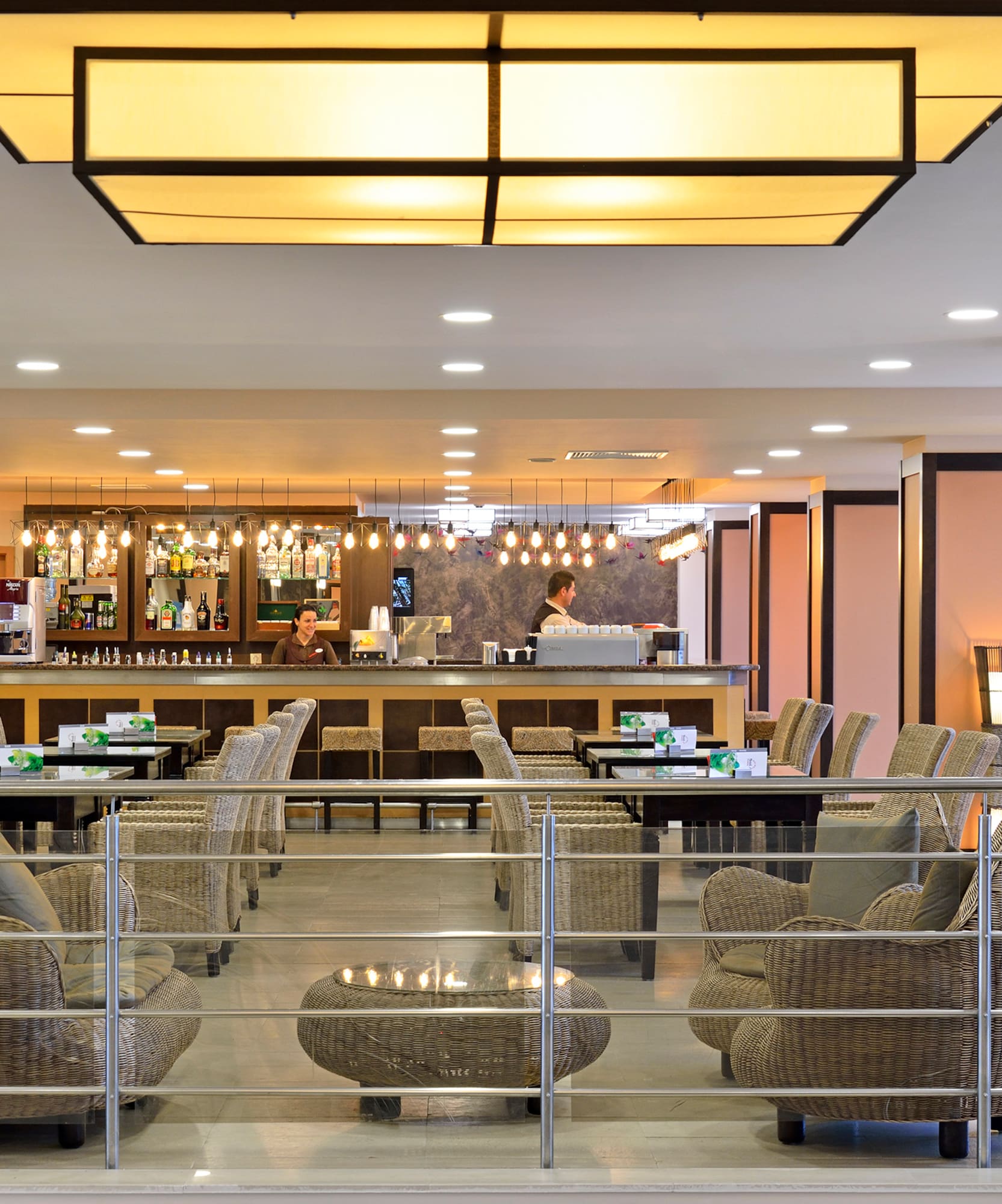 a bar with chairs and tables