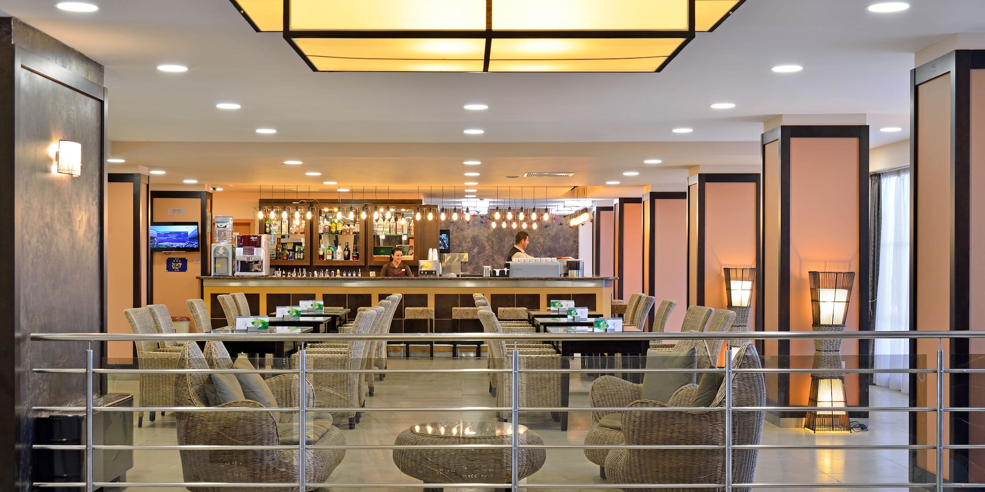 a bar with chairs and tables