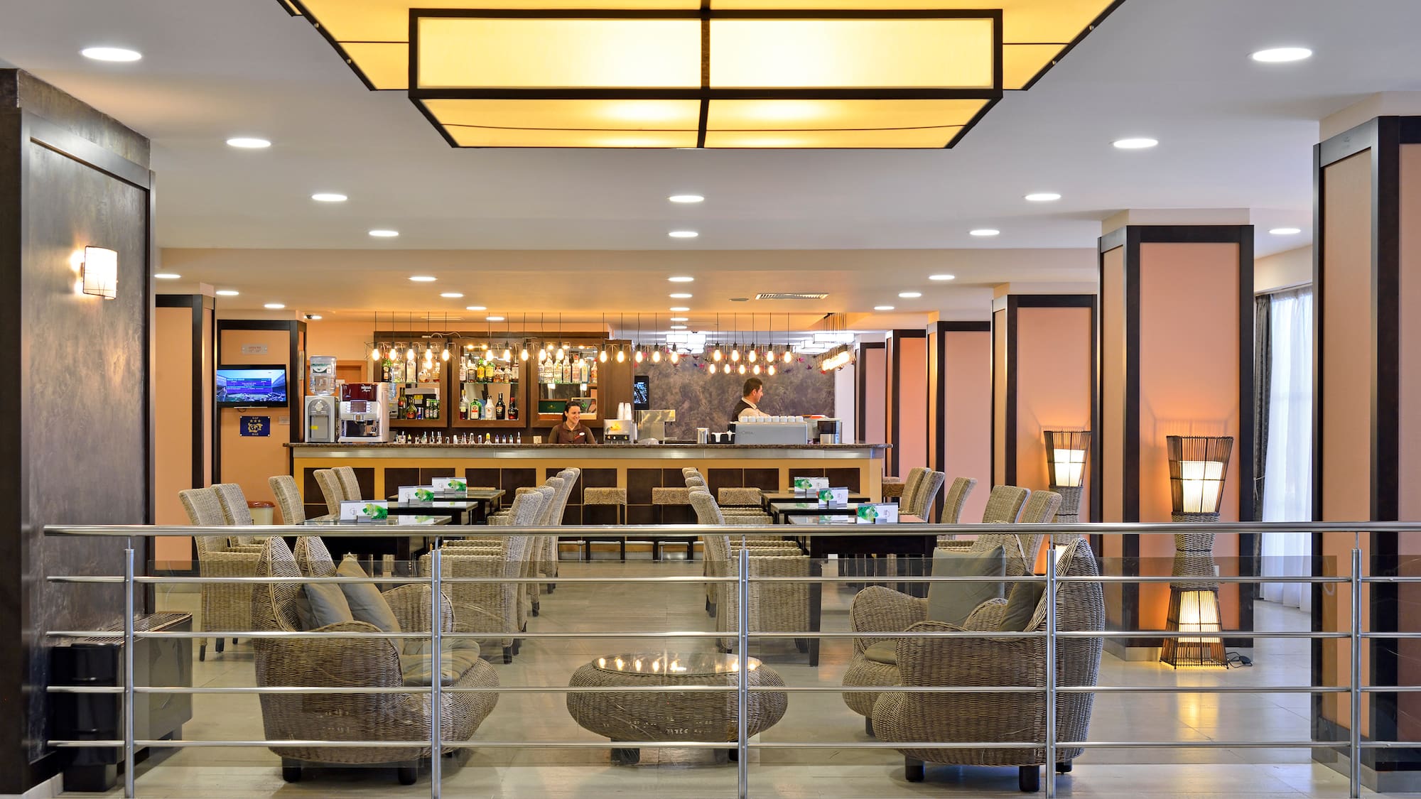 a bar with chairs and tables