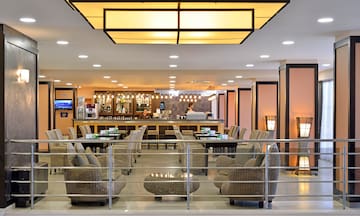 a bar with chairs and tables