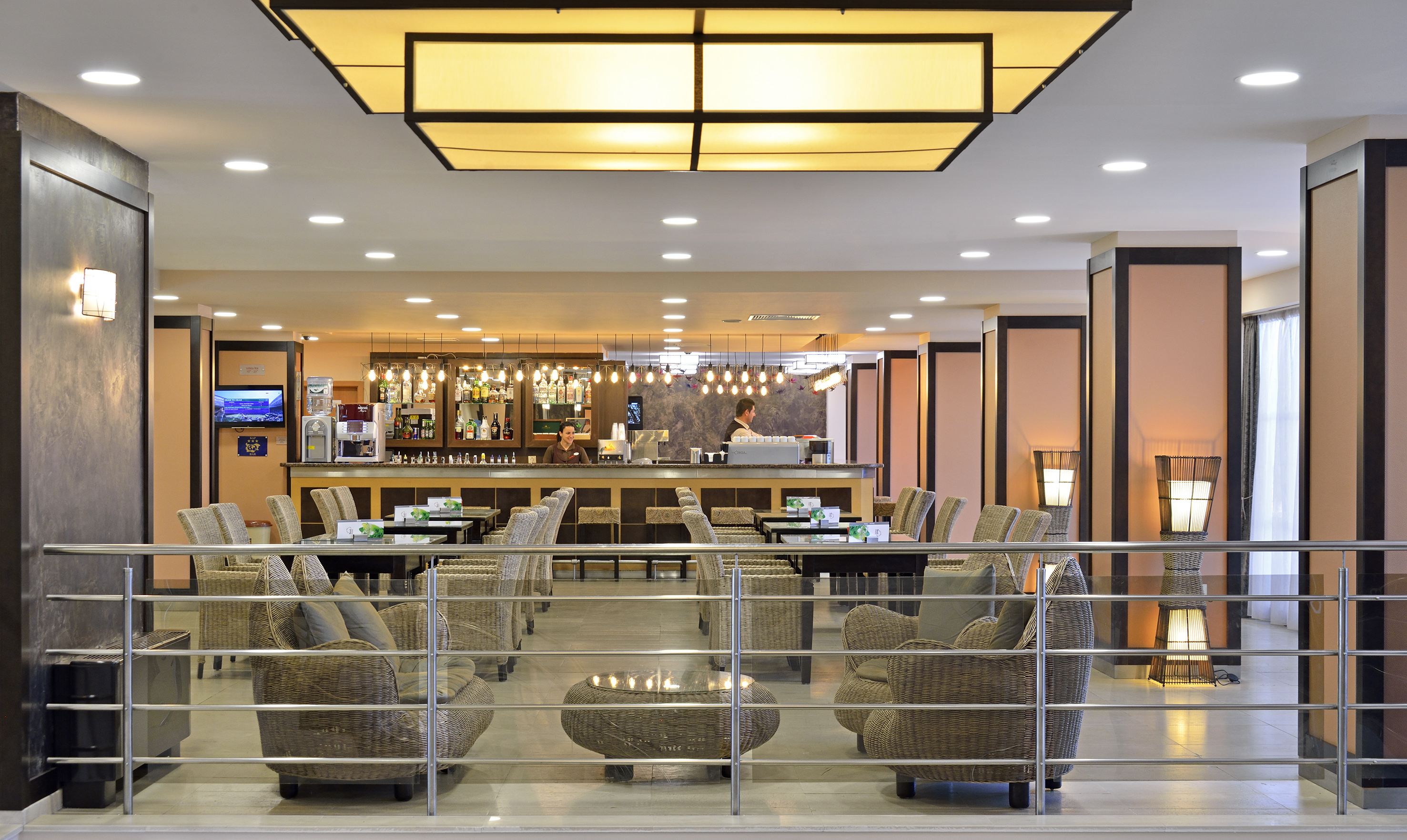 a bar with chairs and tables