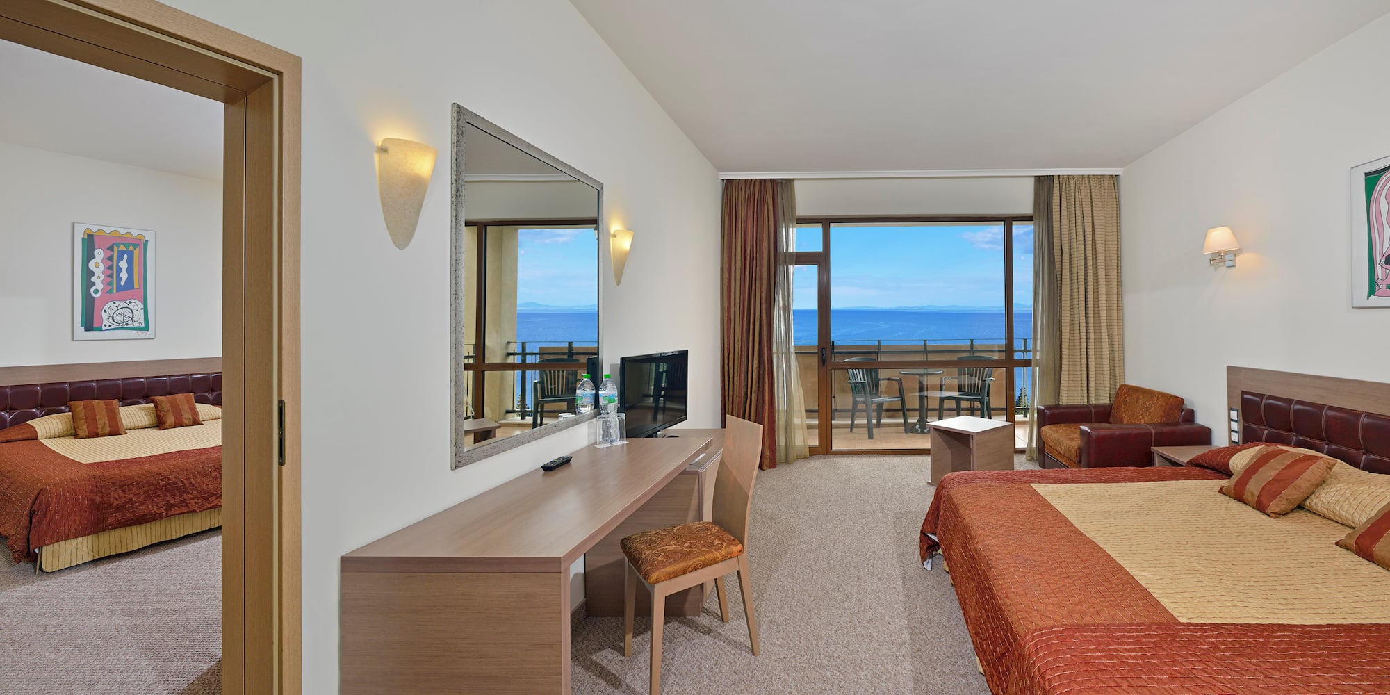 a room with a bed and a mirror