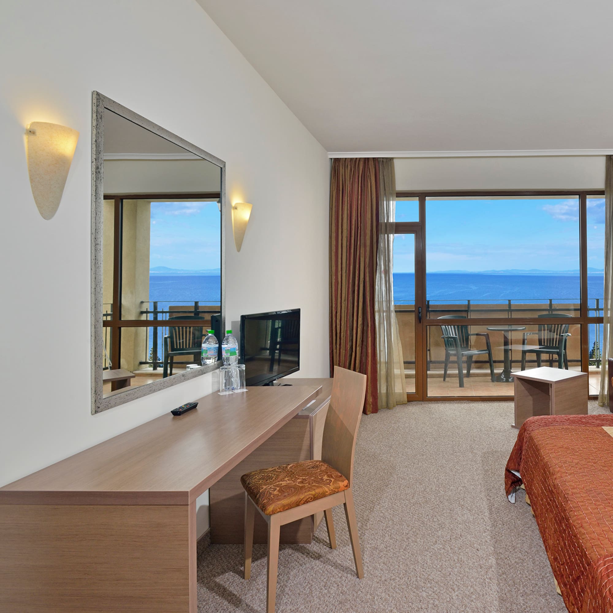 a room with a bed and a mirror