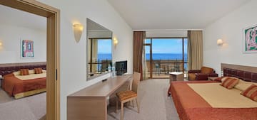 a room with a bed and a mirror