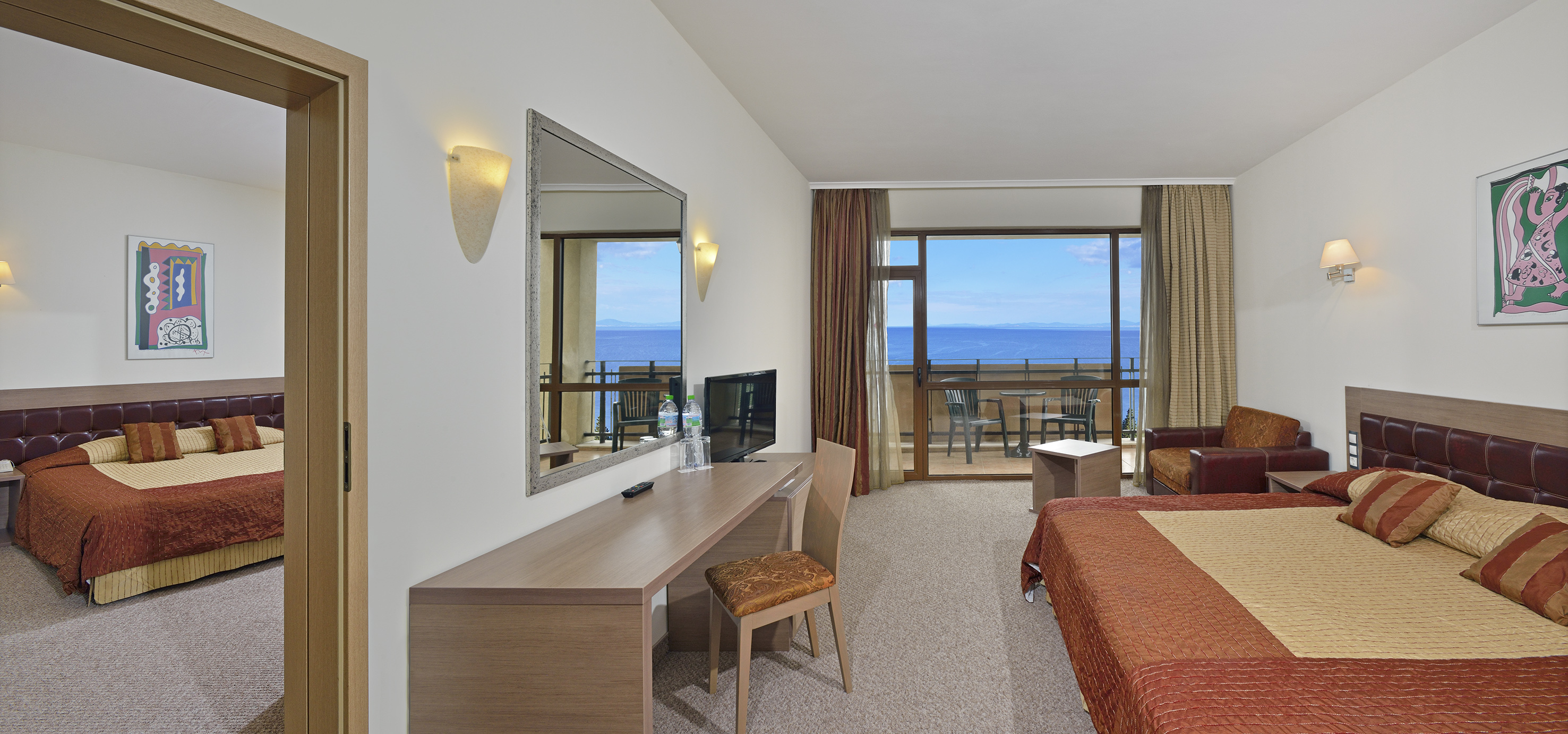 a room with a bed and a mirror