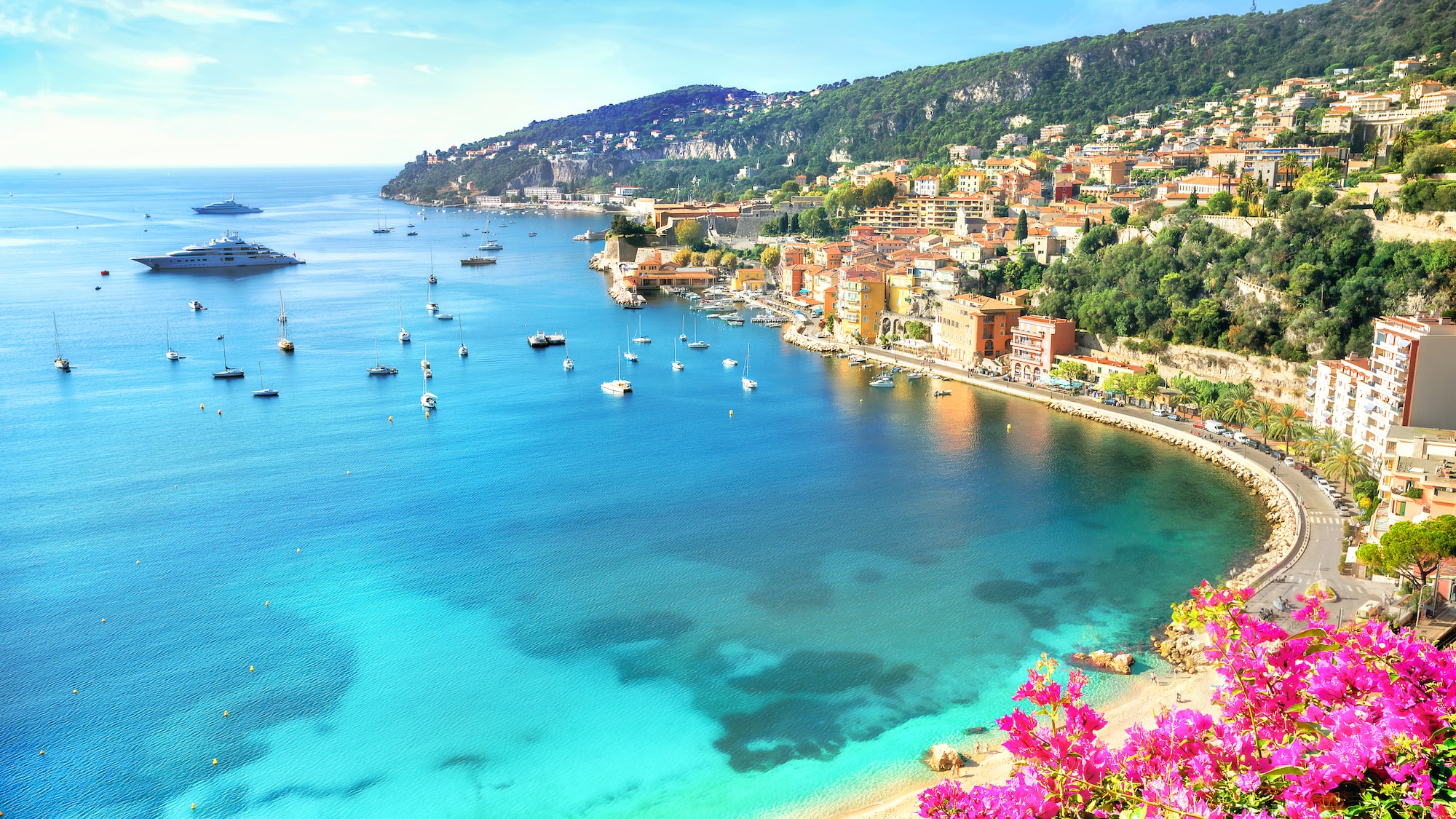 a body of water with boats and buildings on it