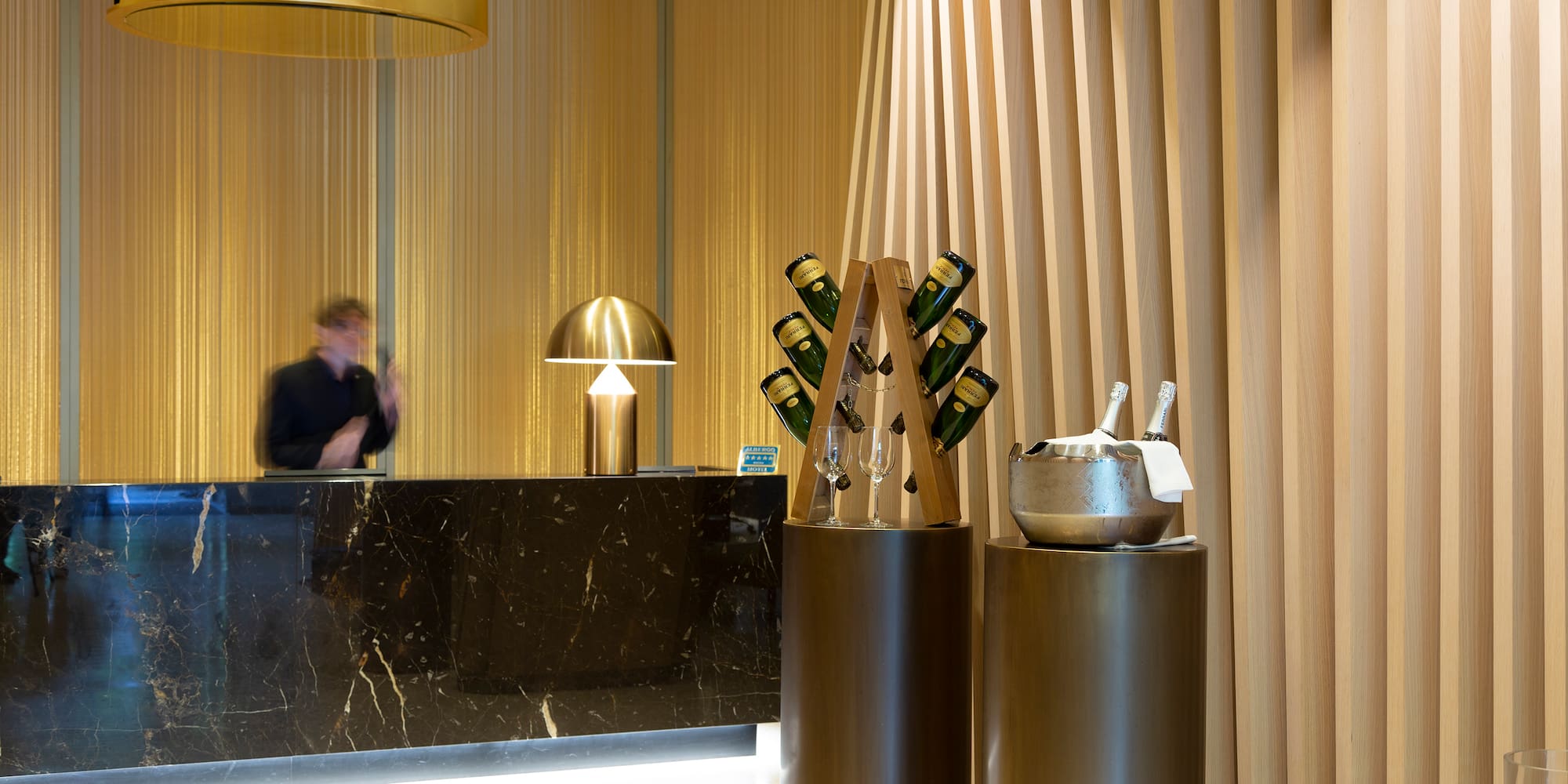 a counter with a group of wine glasses