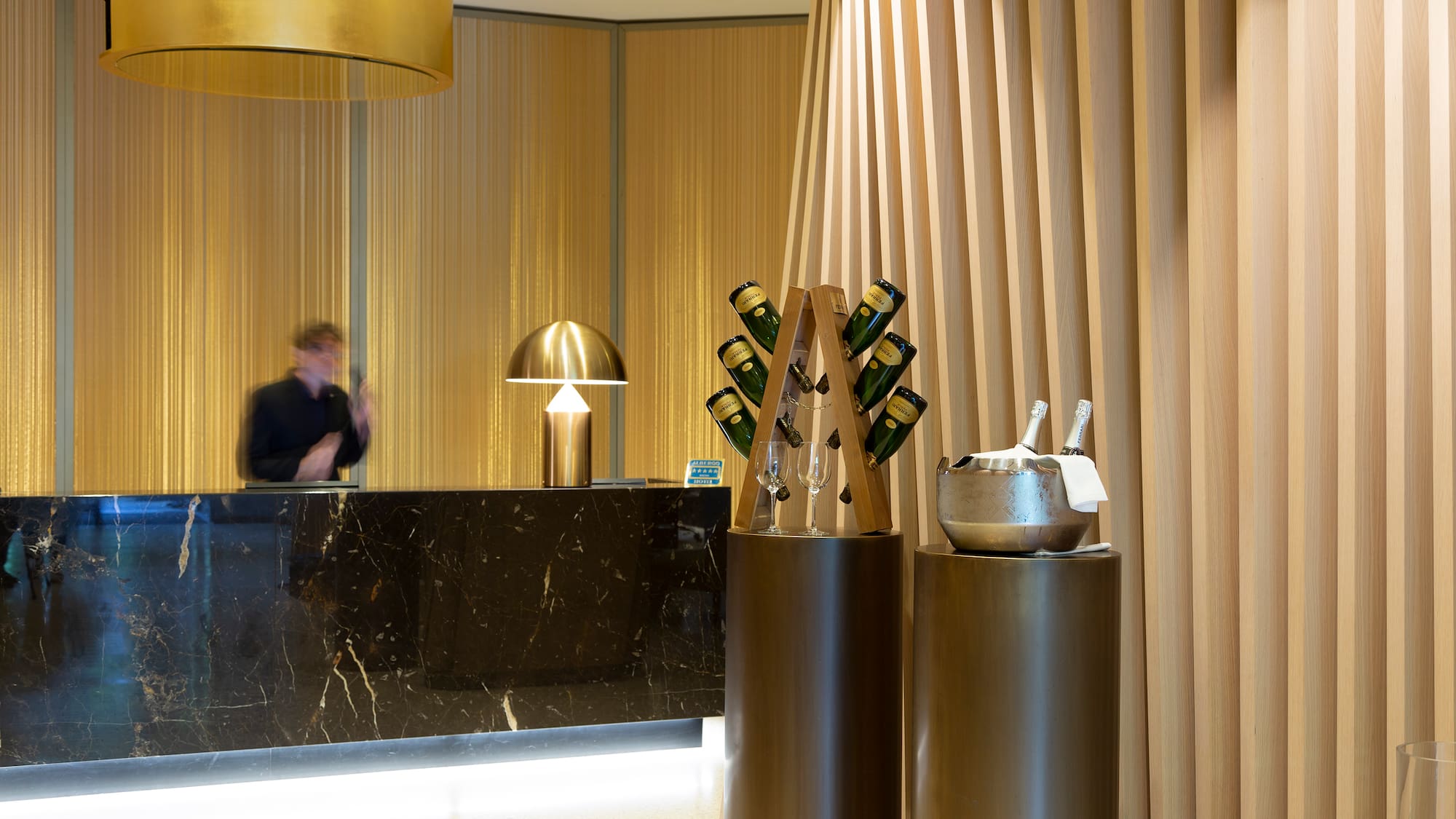 a counter with a group of wine glasses