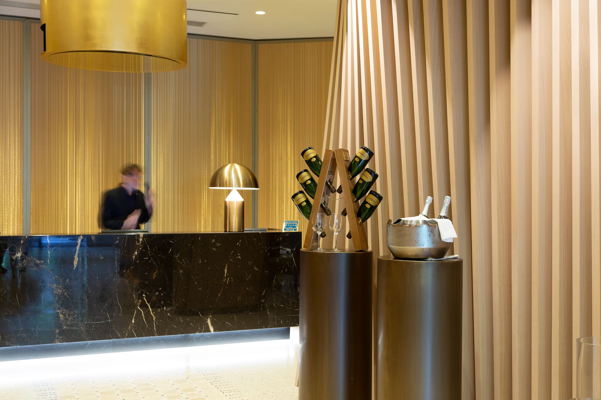 a counter with a group of wine glasses