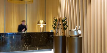 a counter with a group of wine glasses