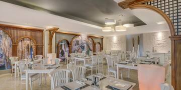 a room with tables and chairs