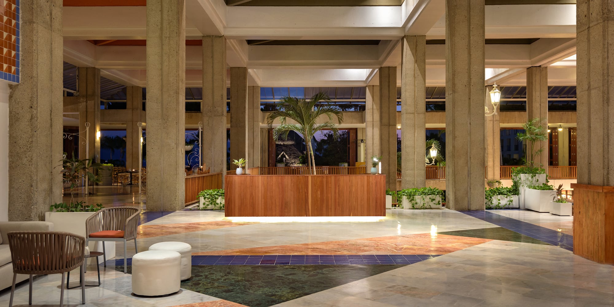 a lobby with a palm tree
