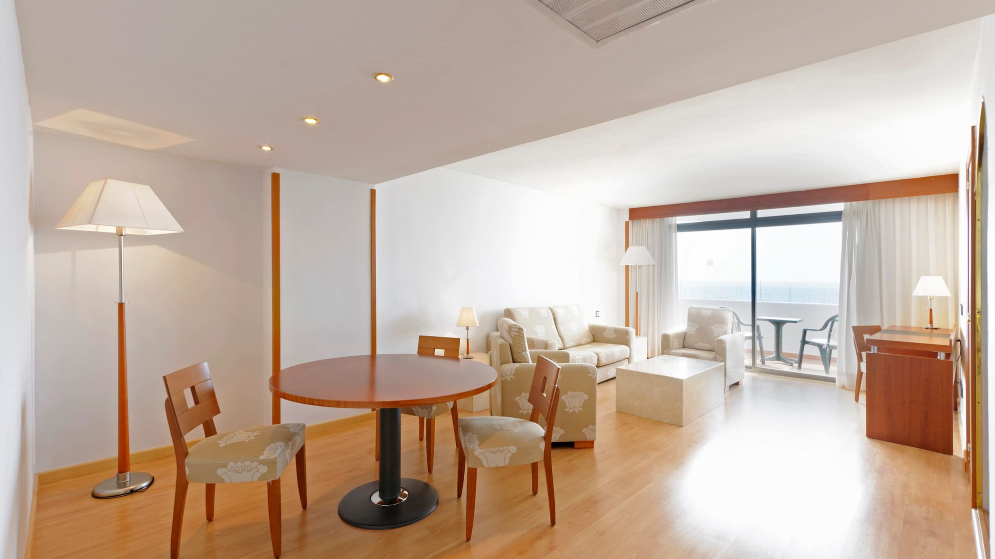 a room with a table and chairs