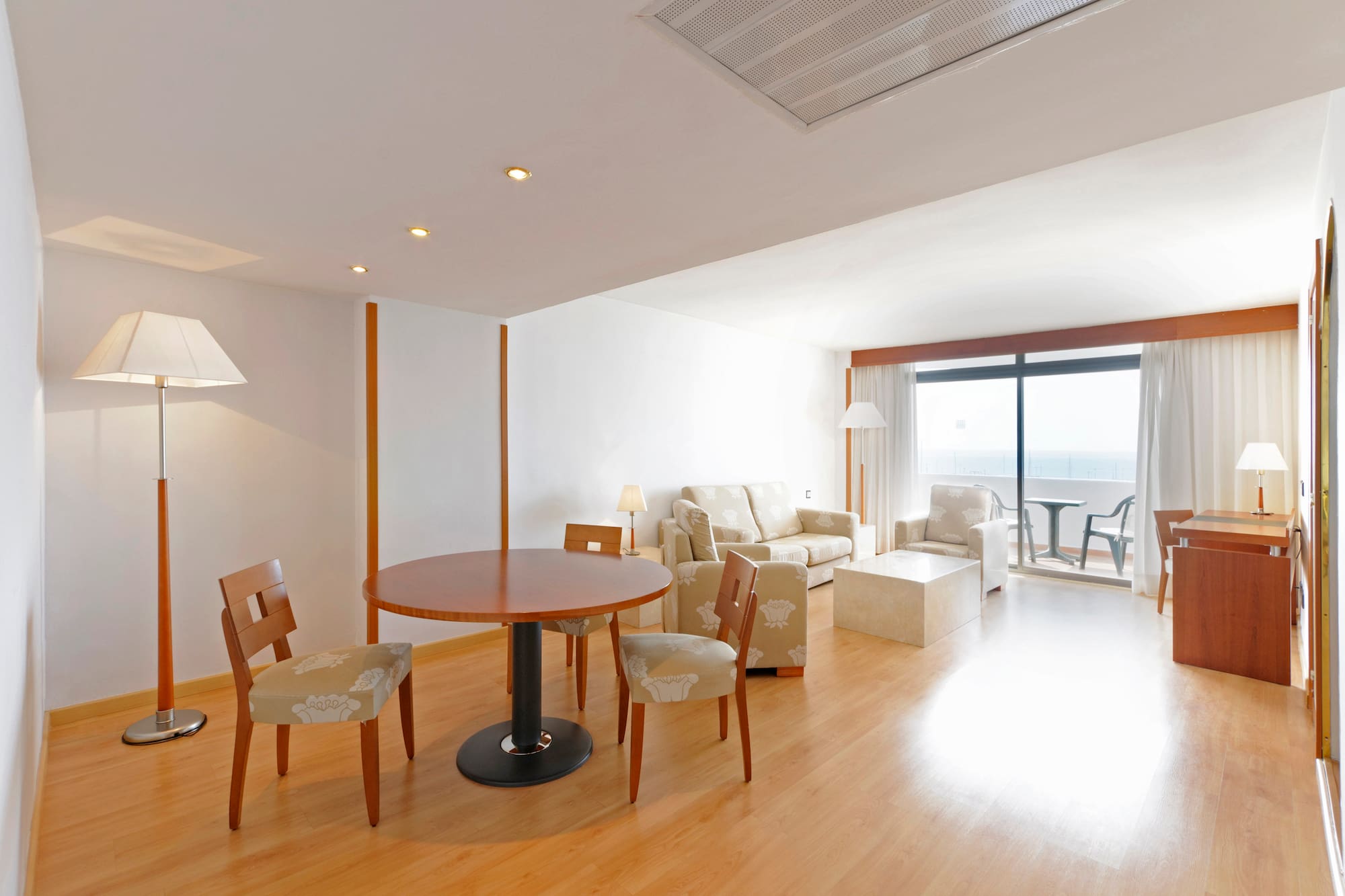 a room with a table and chairs