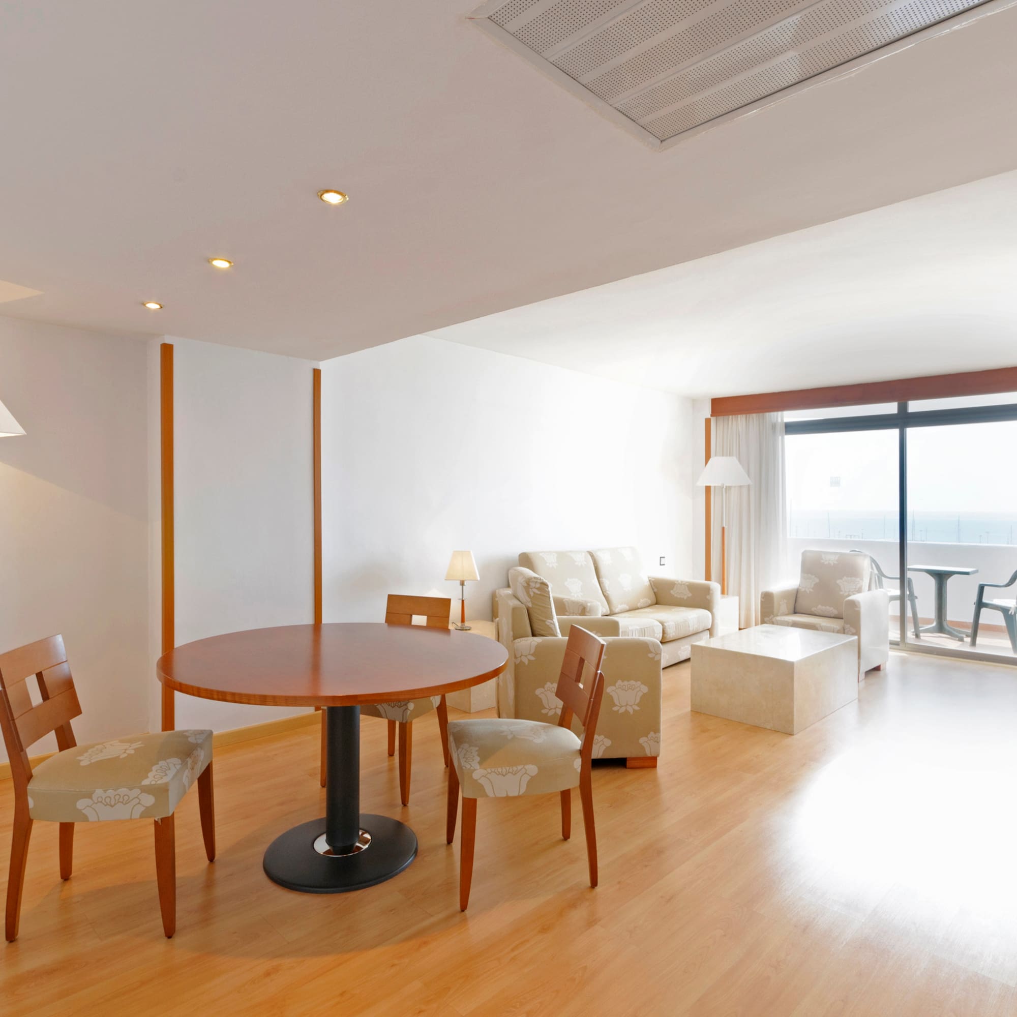 a room with a table and chairs