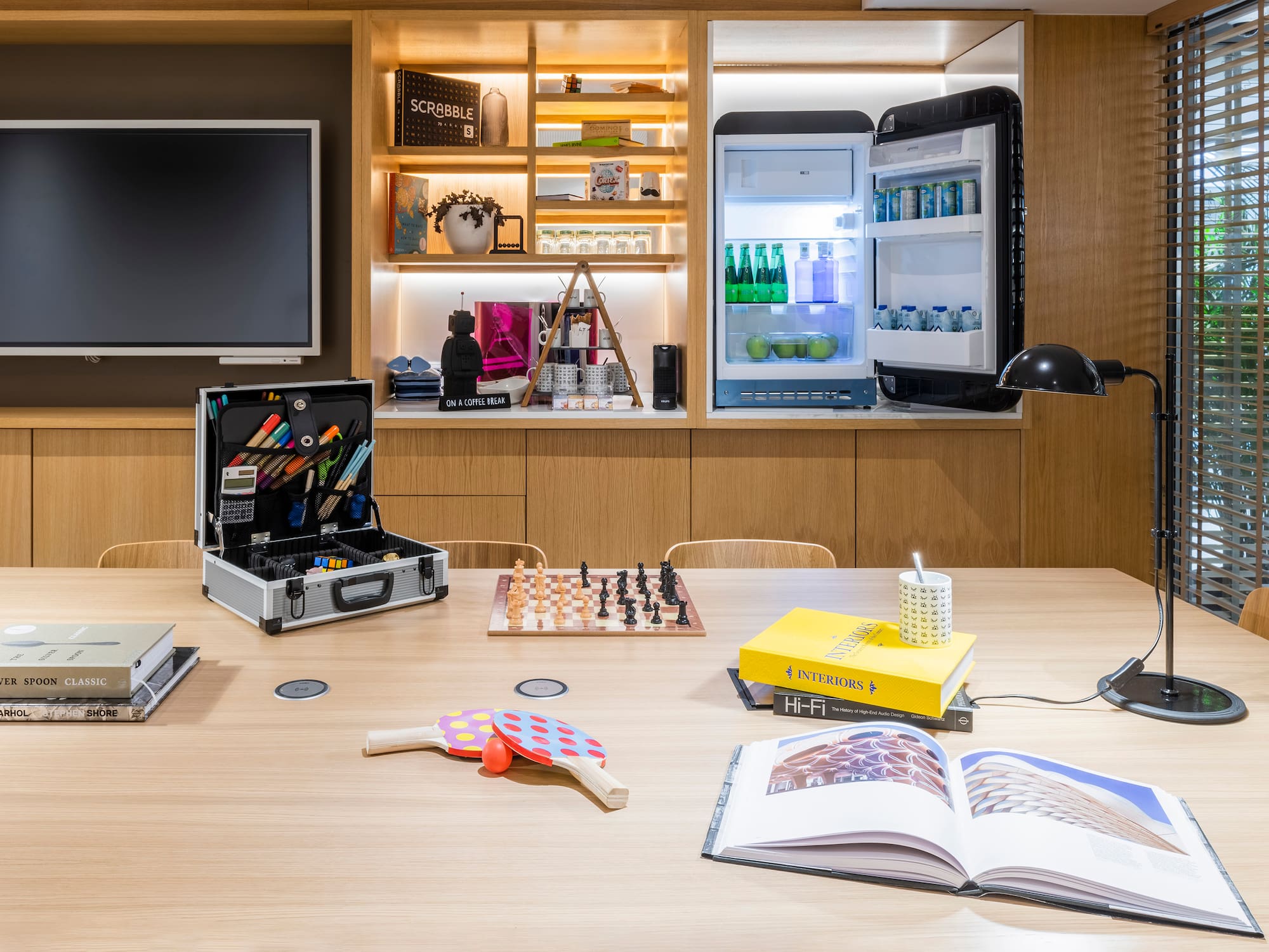 a table with a book and a chess board on it