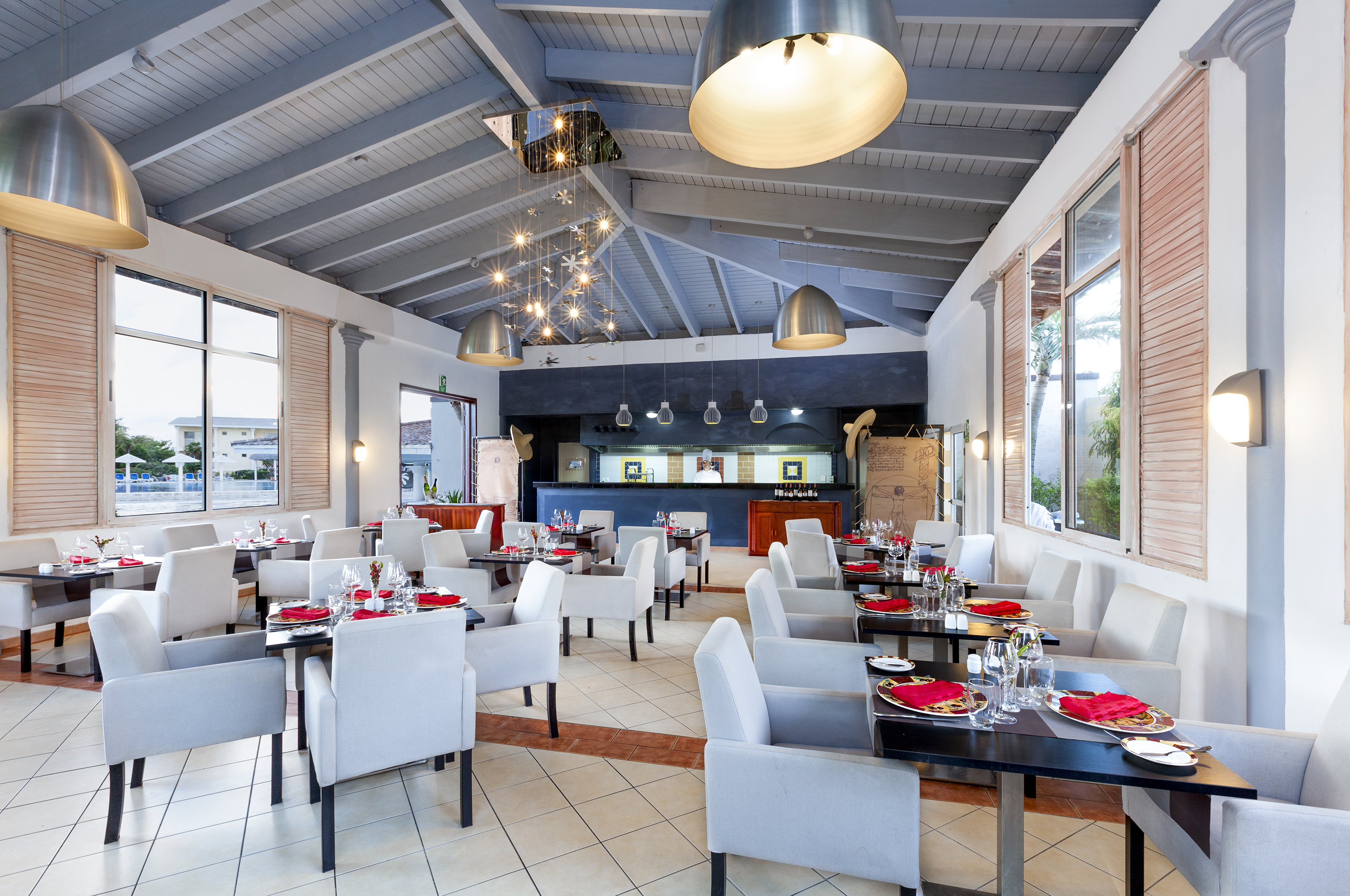 a restaurant with tables and chairs