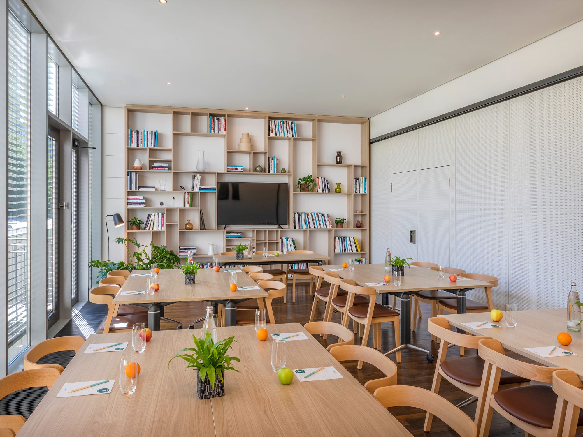 a room with tables and chairs.