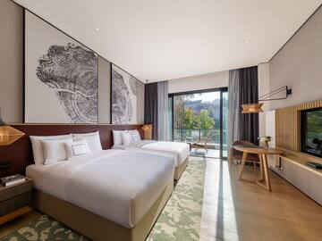 a hotel room with two beds