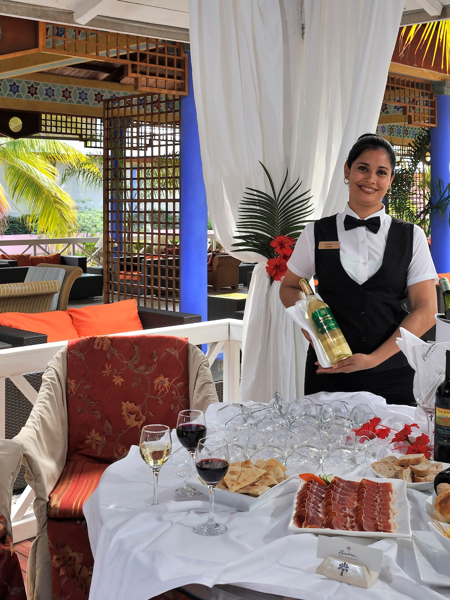 a woman holding a wine bottle