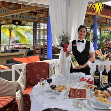 a woman holding a wine bottle