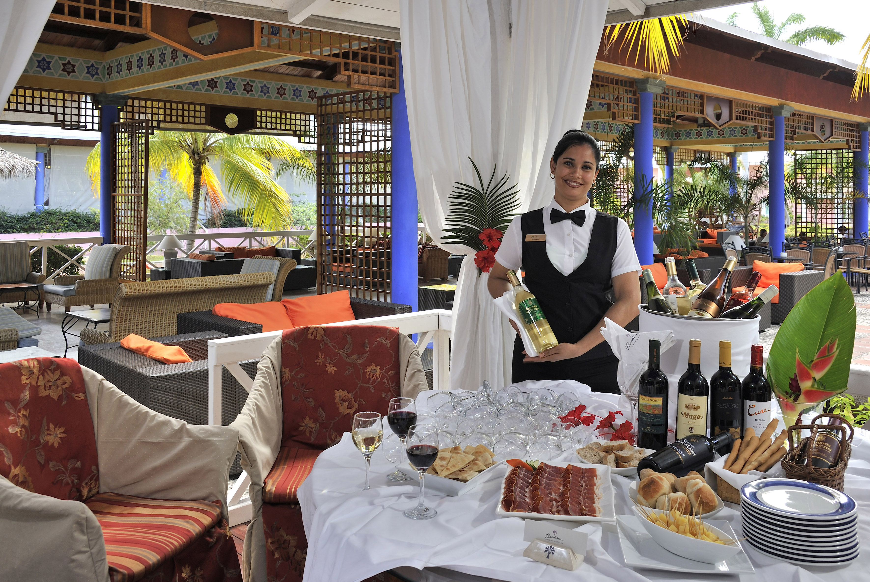 a woman holding a wine bottle