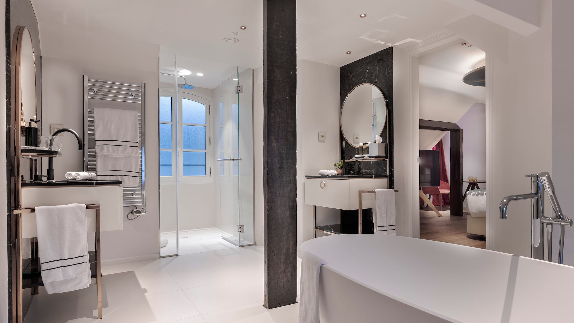 a bathroom with a tub and sink