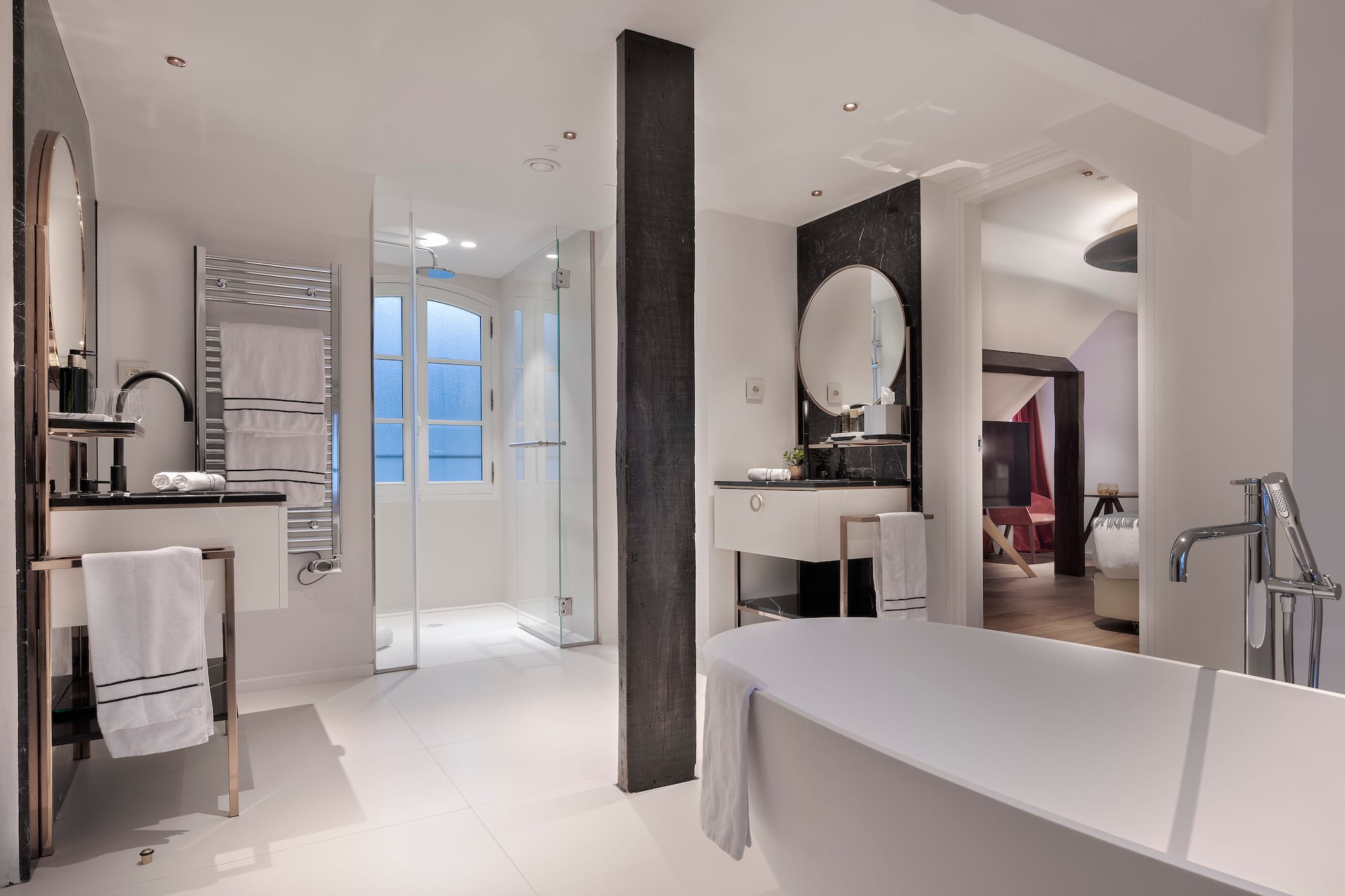 a bathroom with a tub and sink