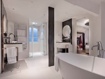 a bathroom with a tub and sink