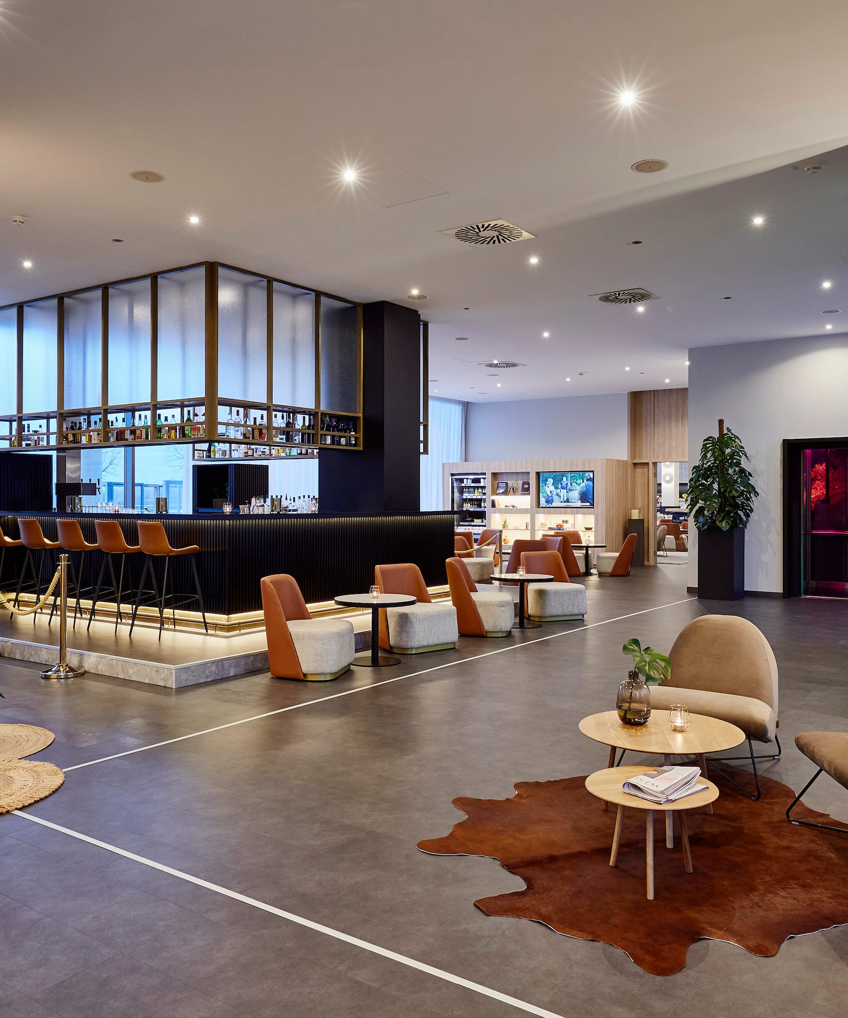 a large room with a large counter and chairs