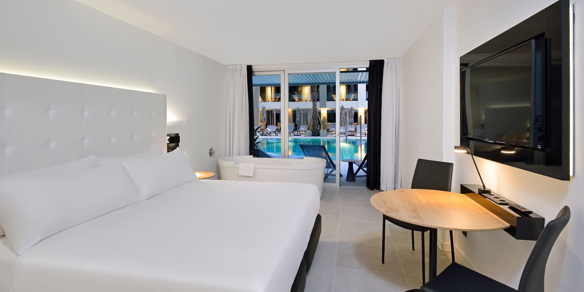 a room with a bed and a tub