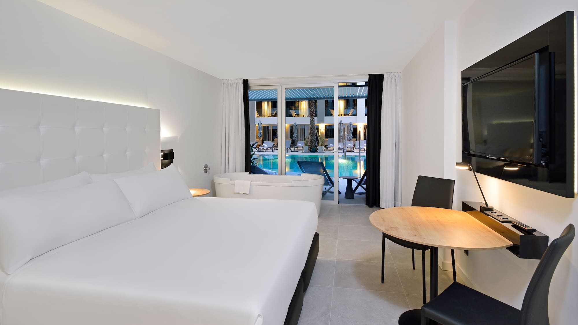 a room with a bed and a tub