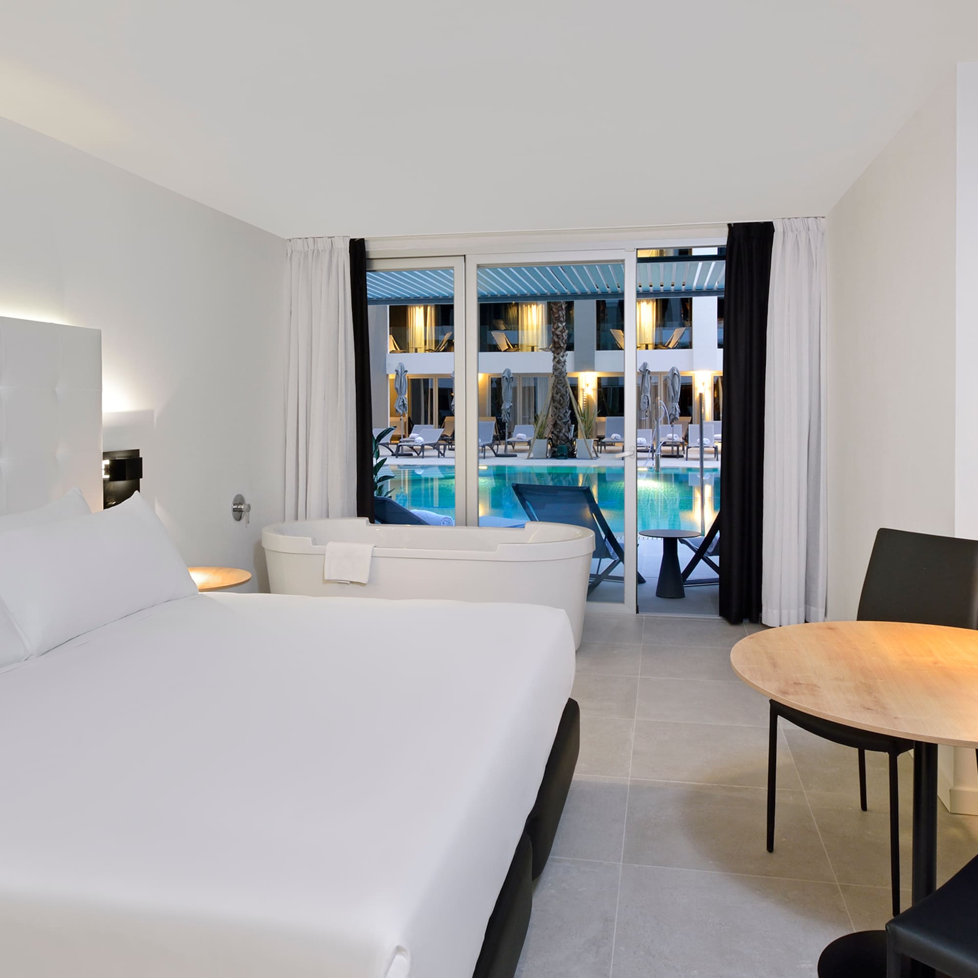 a room with a bed and a tub