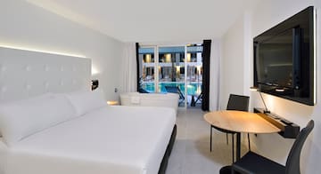 a room with a bed and a tub