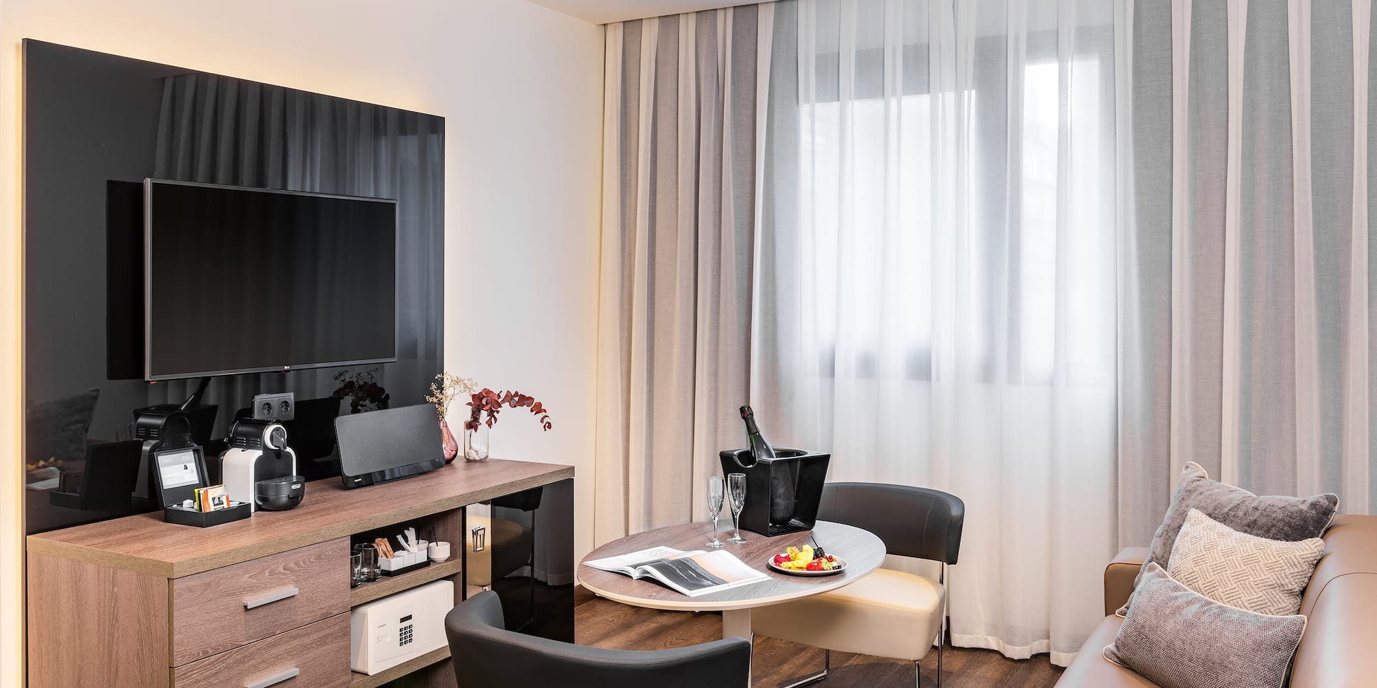 a room with a tv and a table