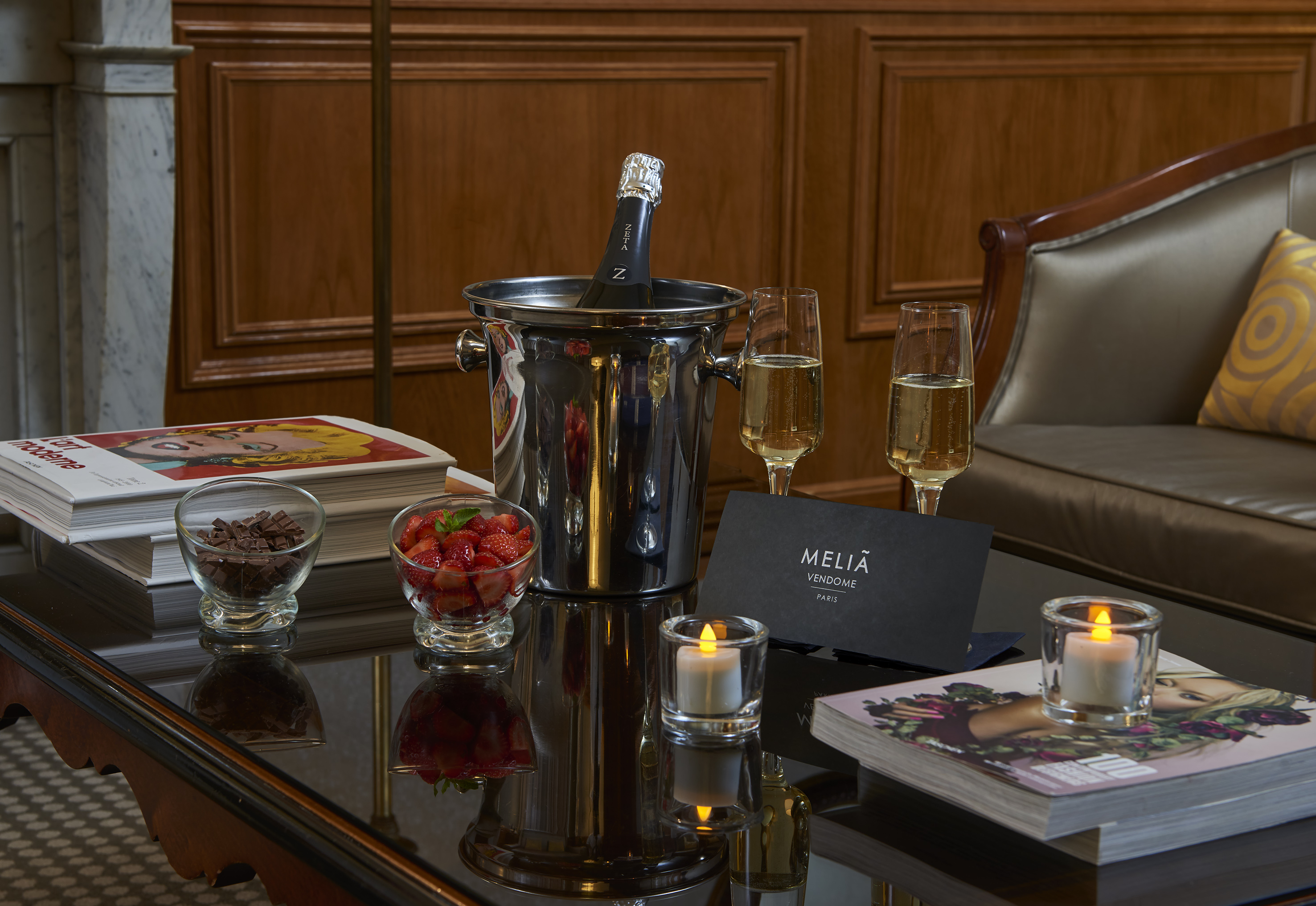 Meliá Vendome Paris hotel welcome: champagne, strawberries, chocolate, and candles.