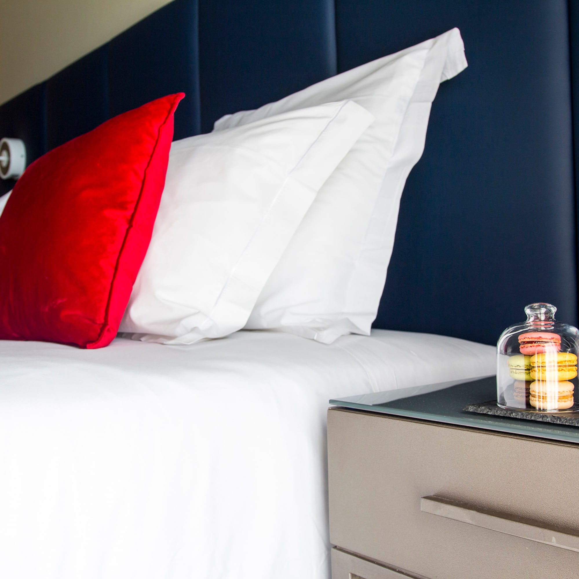 a bed with a glass bell on top